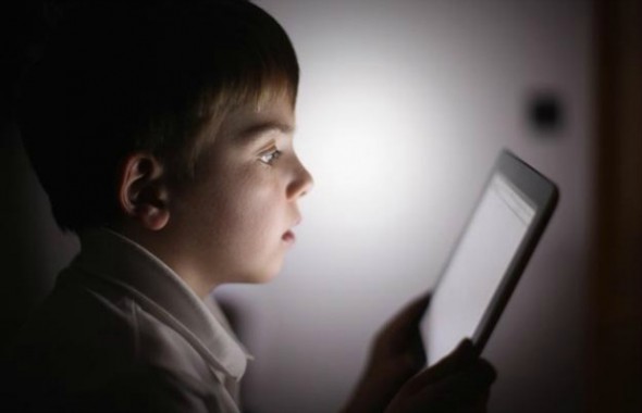 Child with tablet learning.